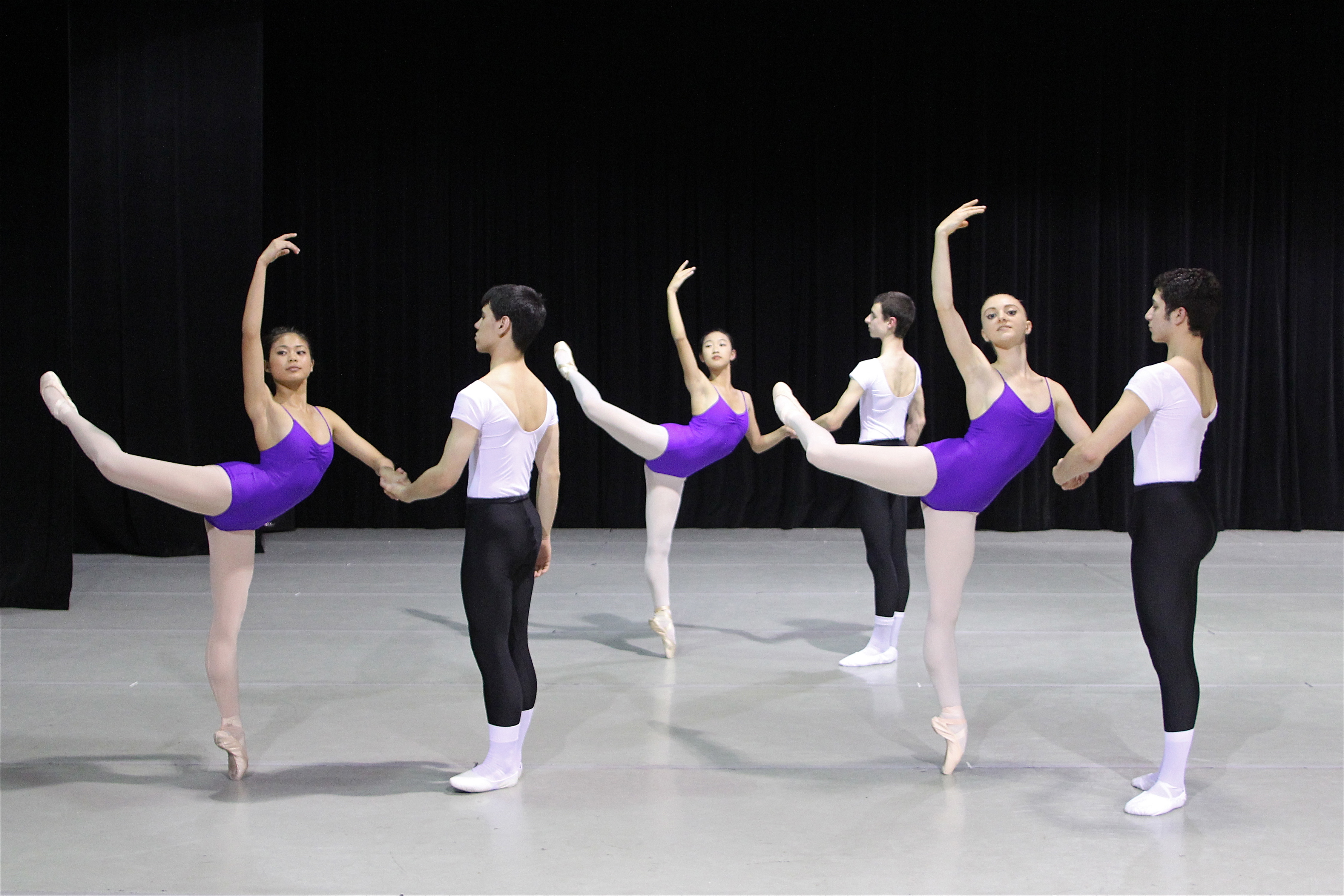 Students of the American Ballet Theatre practice dancing with their partner.