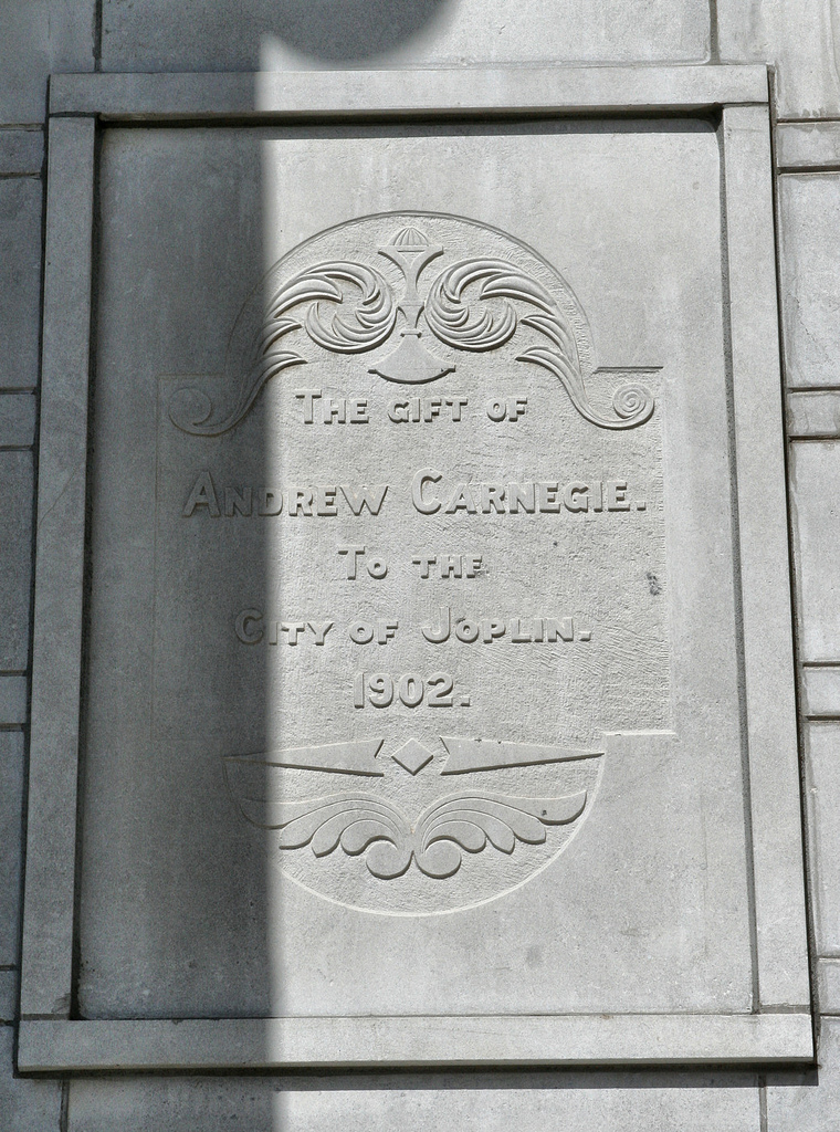 The plaque commemorating the gift from Andrew Carnegie located next to the building's entrance
