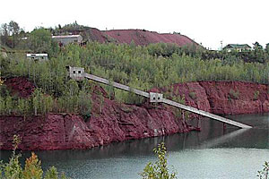 Mining operations ceased in 1978, and trees and other plants once again grow around the former open-pit mine.