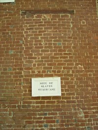 Site of old slave staircase in rear of building.