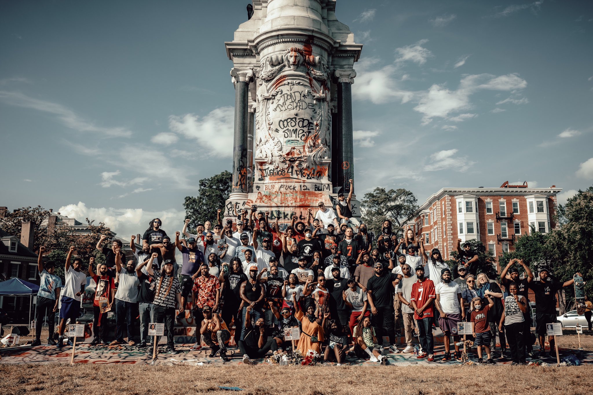 Protestors stand in front of the Lee Monument in June 2020