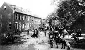 McKee Row in Charlottesville around 1919. This row was demolished to make way for Jackson Park and the statue. Courtesy of the Holsinger Studio Collection, Special Collections Department, University of Virginia Library