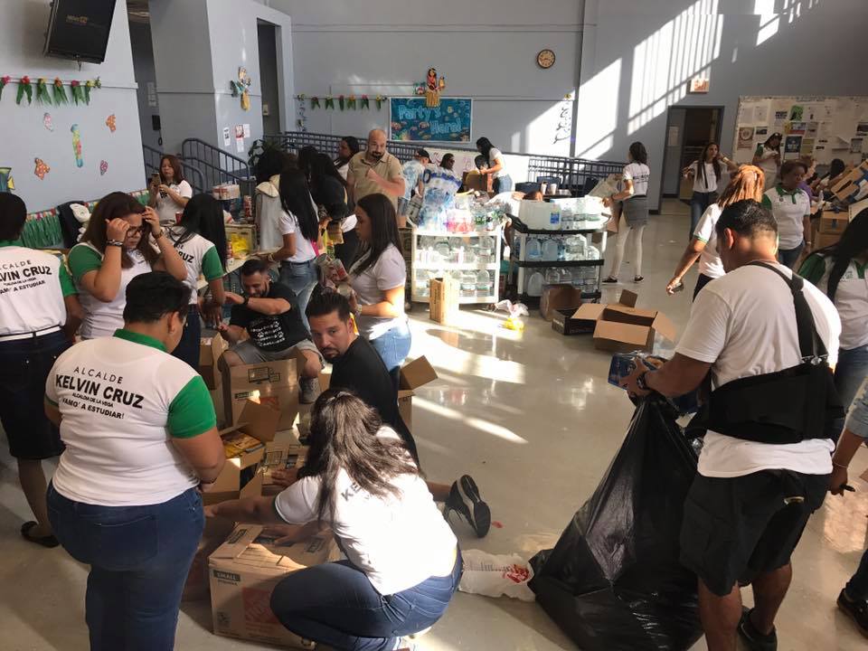 Students helping to pack goods that were donated by community members in the "United for Puerto Rico" donation drive after Hurricane Maria.