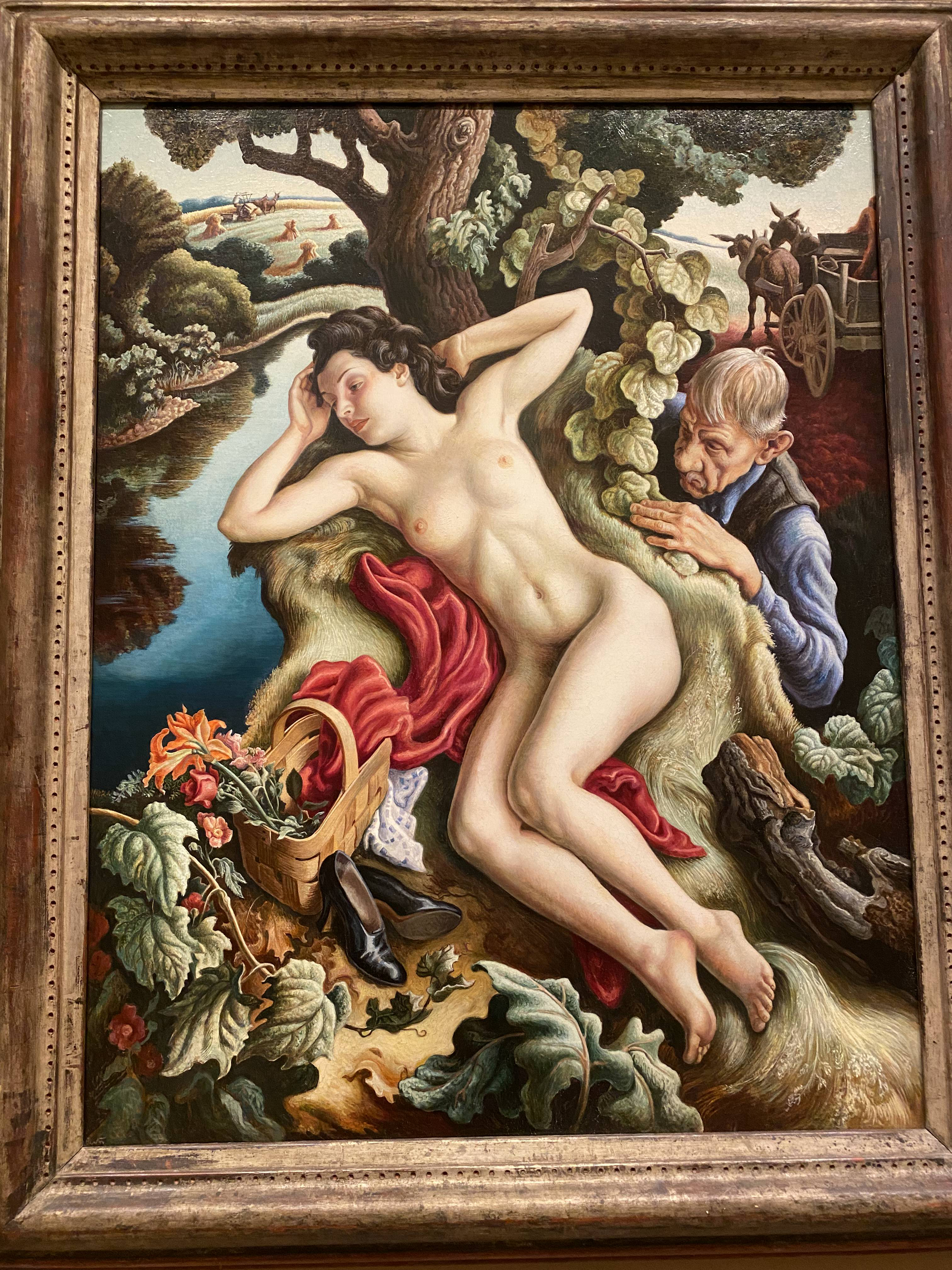 A nude white woman lays next to a stream. An old white man peeps at her from behind a tree.