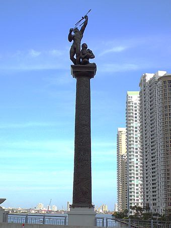 Statue of a Tequesta warrior and family on Brickell Avenue Bridge, Miami