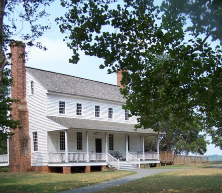 House in the Horseshoe. In spring and summer, bright flowers surround this plantation house named for its location on a horseshoe bend in the Deep River.