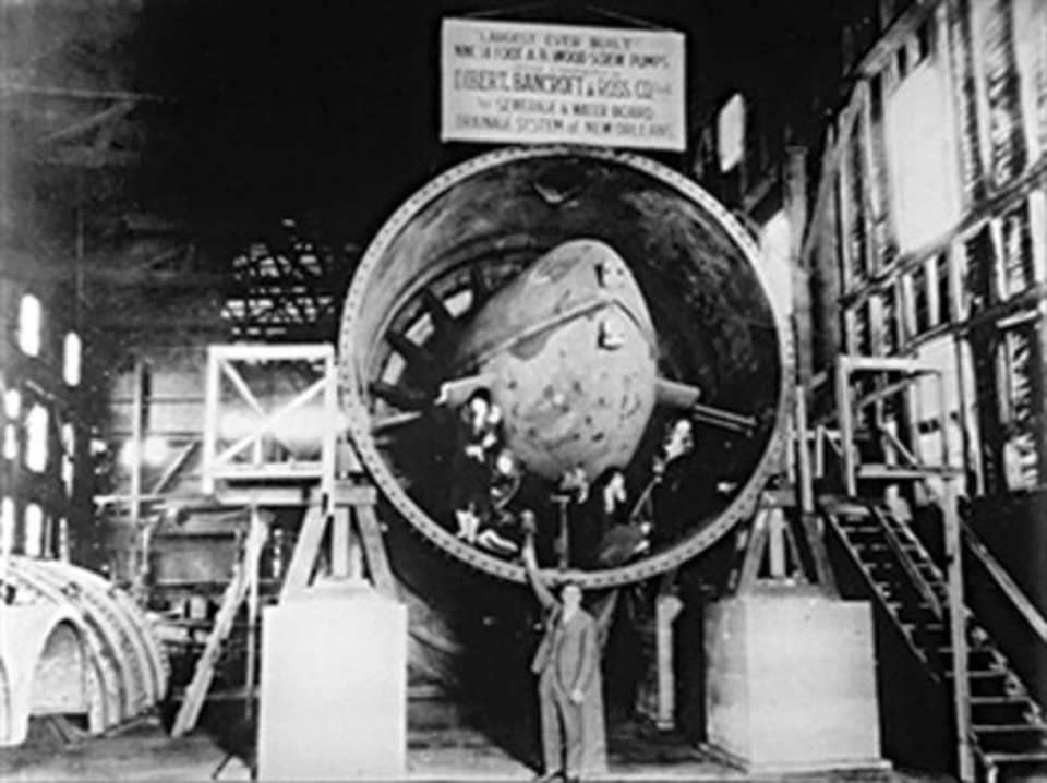 Albert Baldwin Wood standing in front of a partially constructed screw pump.