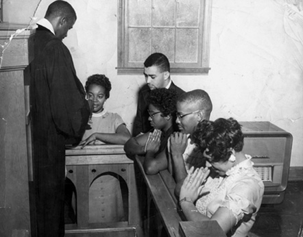 Five of the protesters praying, photo courtesy of Virginia Williams.