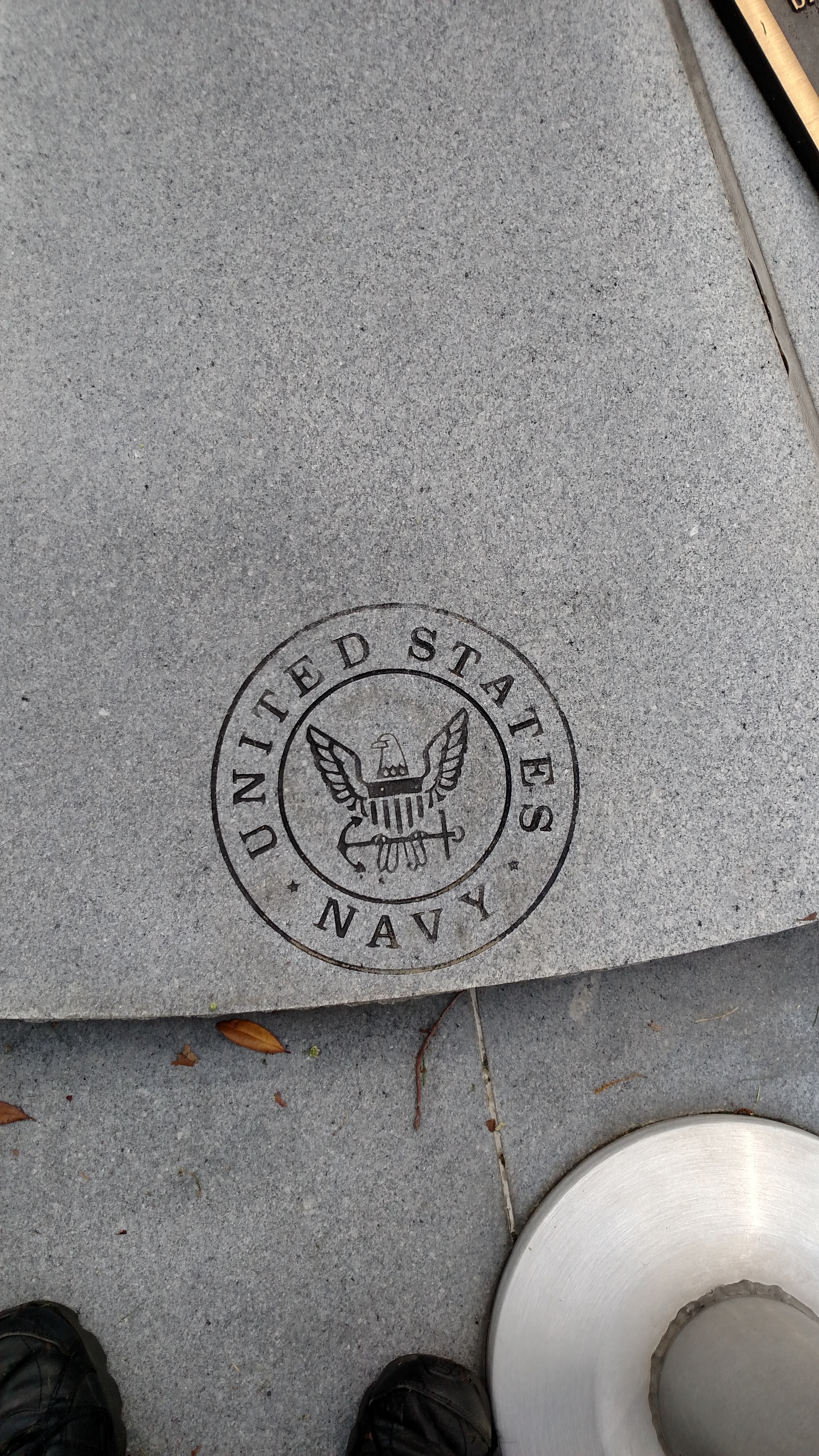 One of five marble sections of the memorial dedicated the the United States Navy.  In front of this section is the flagpole flying the US Navy colors.