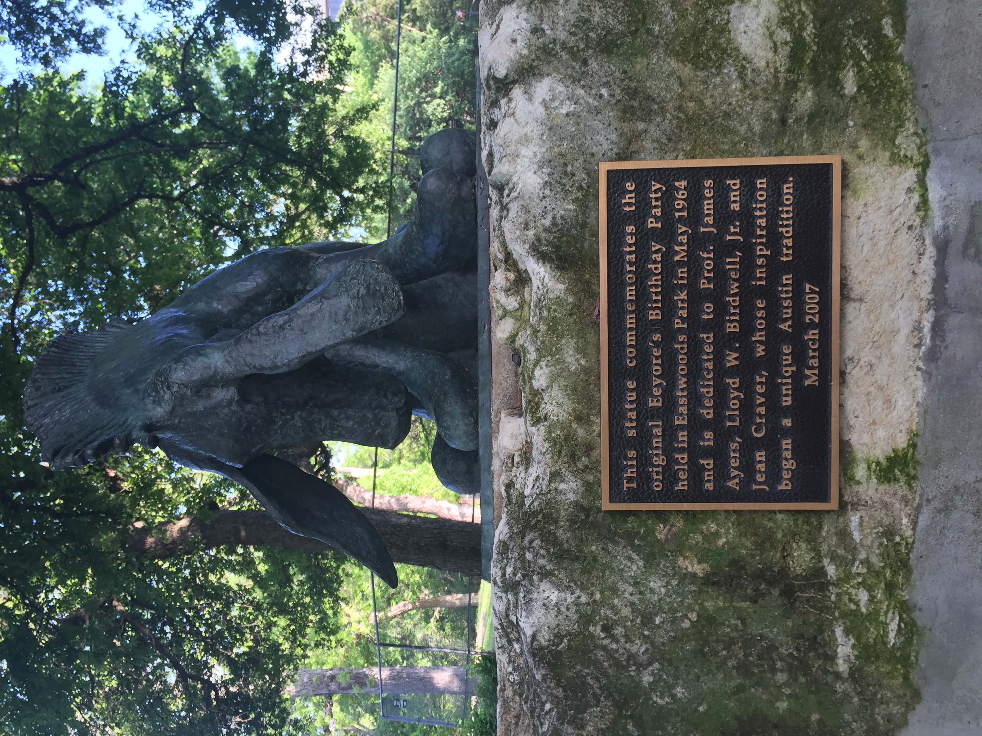 The Statue of Eeyore. Although the plaque commemorates the founding in 1964, Eeyore's Birthday was celebrated at the end of the year English Department picnic in 1963.