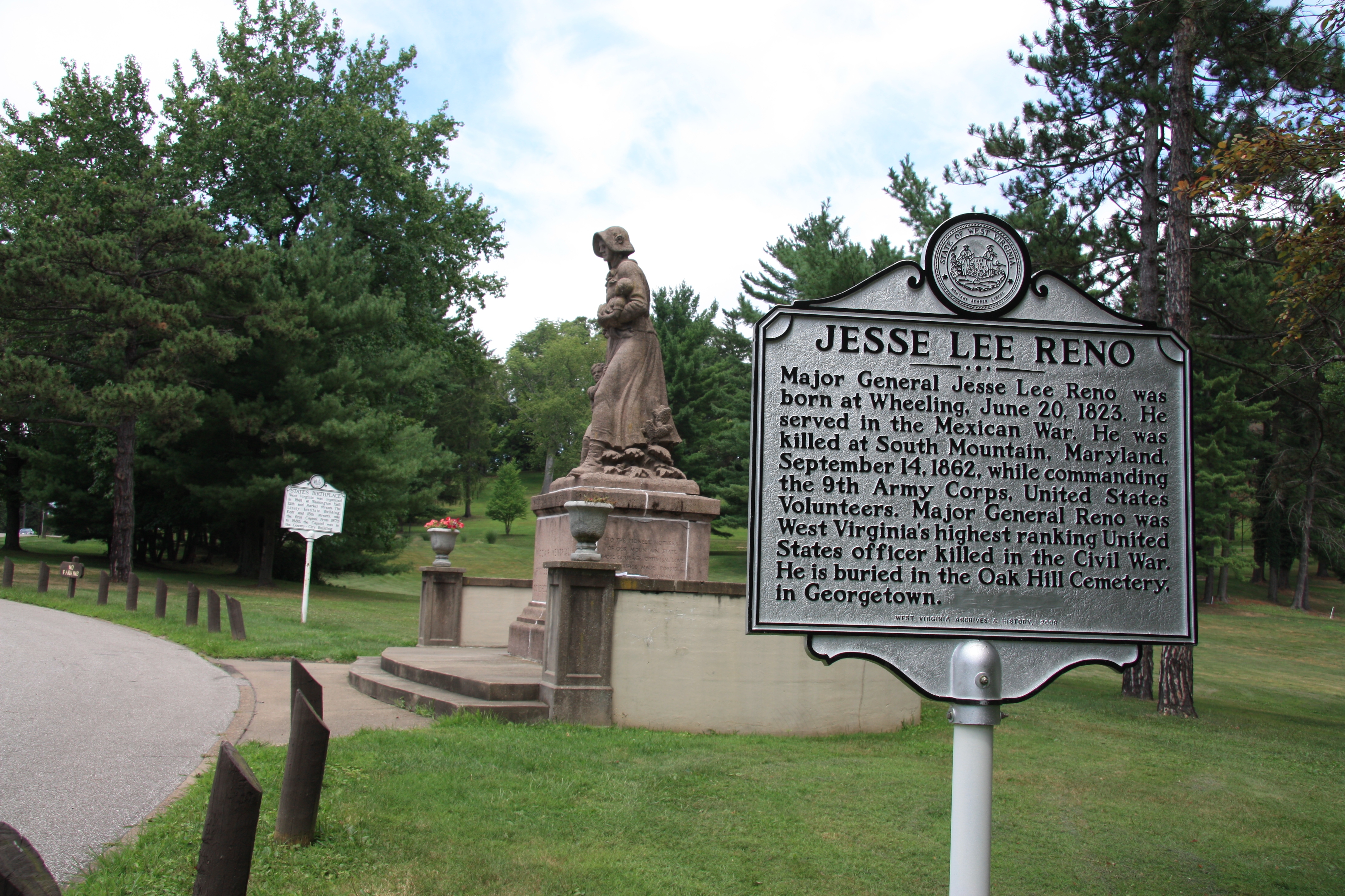 Jesse Lee Reno Historical Marker, with the Madonna of the Trailer monument nearby