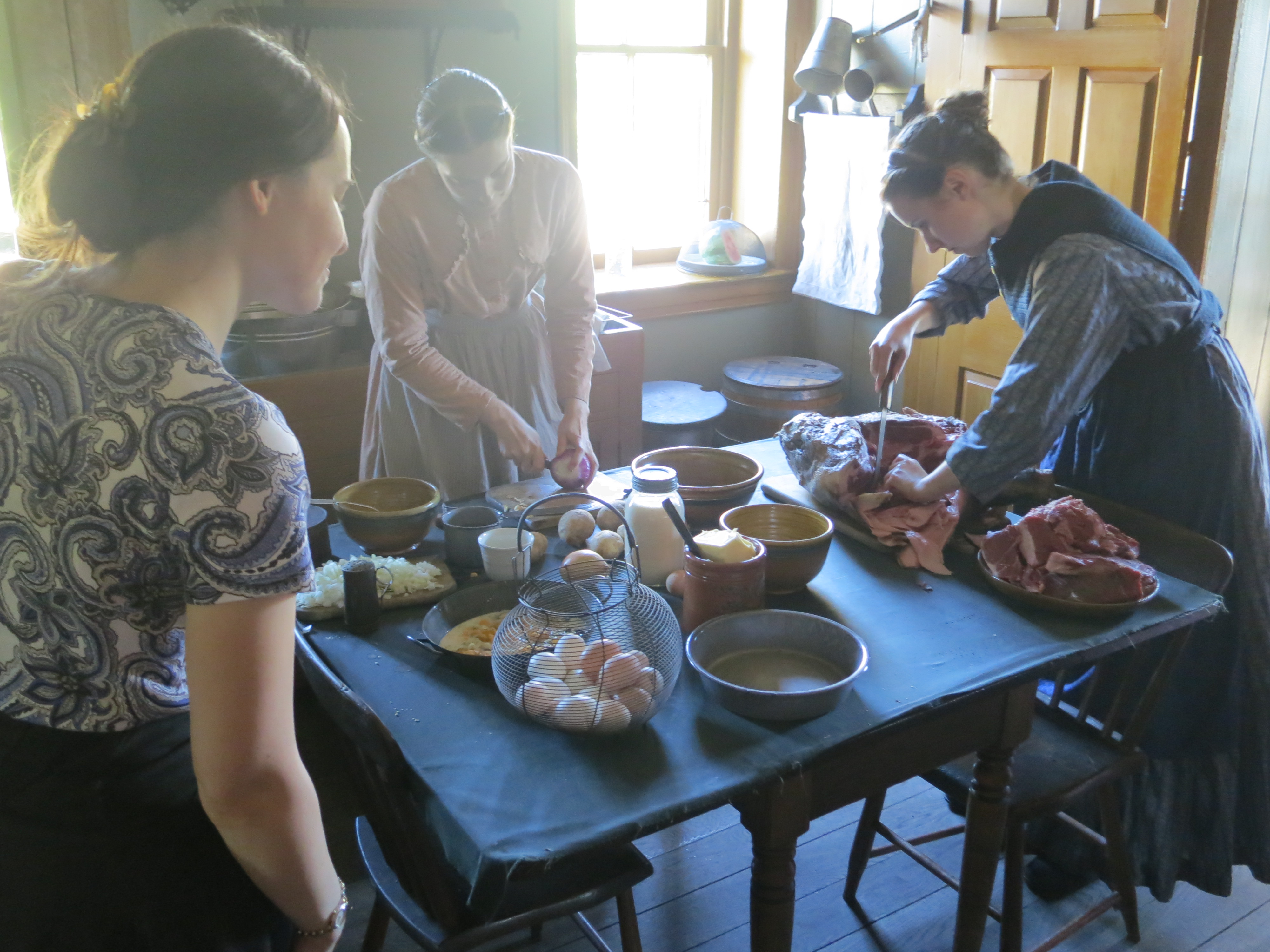Demonstrators prepare lunch at the farmhouse