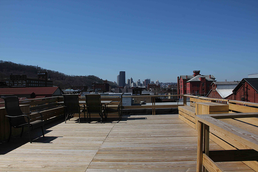 The Top Floor Patio of the Brass Building Lofts 