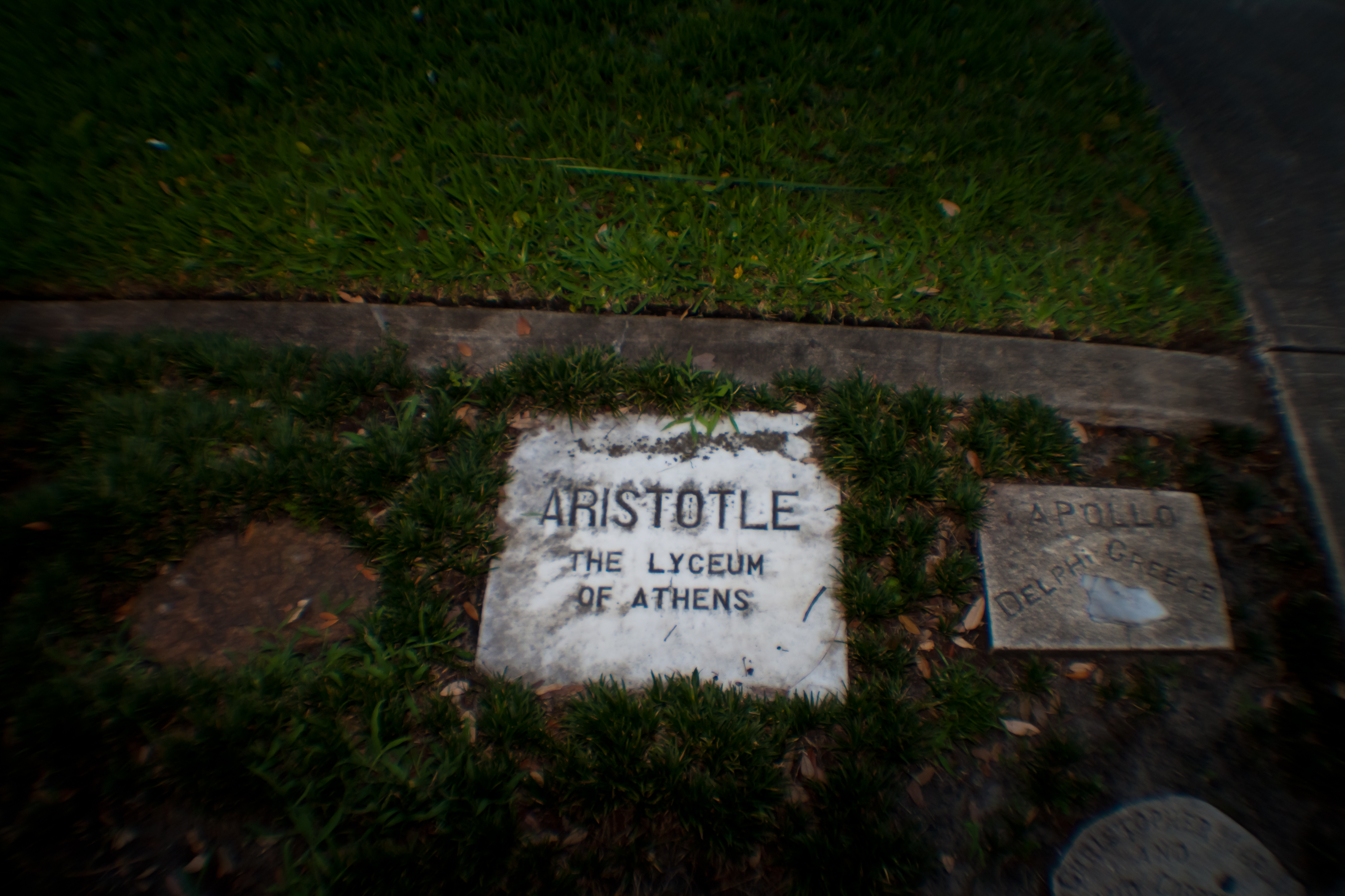 White marble slab marked with the name “Aristotle,” taken from a location near the Lyceum in Athens, Greece. Image by ATrumbly via Flickr Creative Commons, 2.0