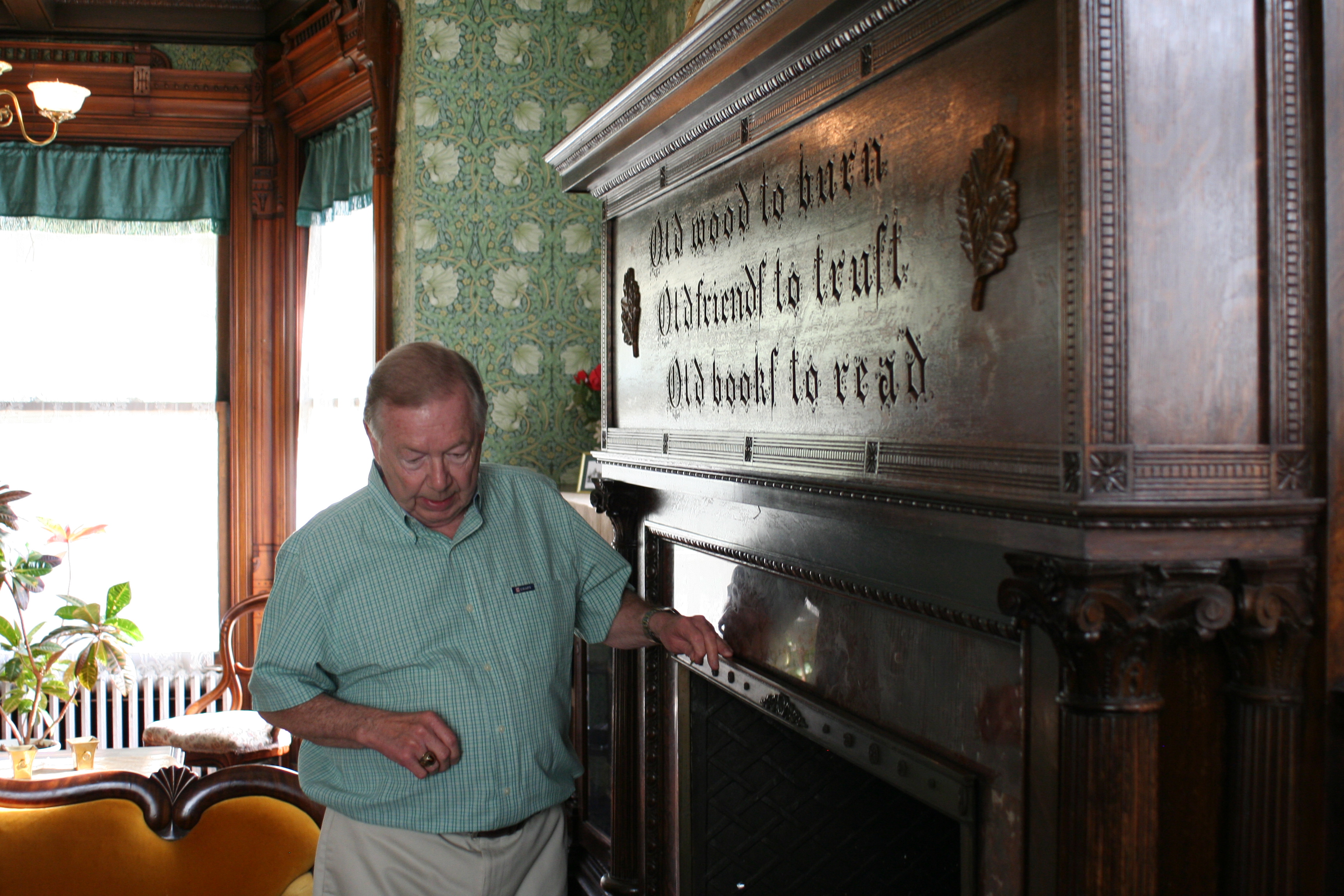 The center's curator stands in front of one of its many fireplaces.
