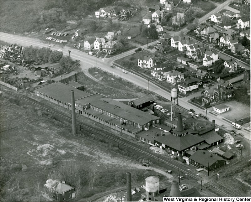 A view of Seneca Glass's strategic location between the Monongahela River and Beechurst Avenue. The Sunnyside neighborhood is located within walking distance. Photo circa 1955, courtesy of the West Virginia and Regional History Center, WVU Libraries.