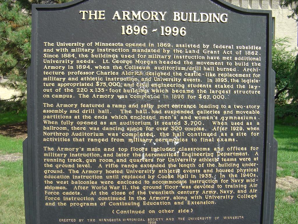 The front side of the plaque outside the Armory, detailing its first hundred years
