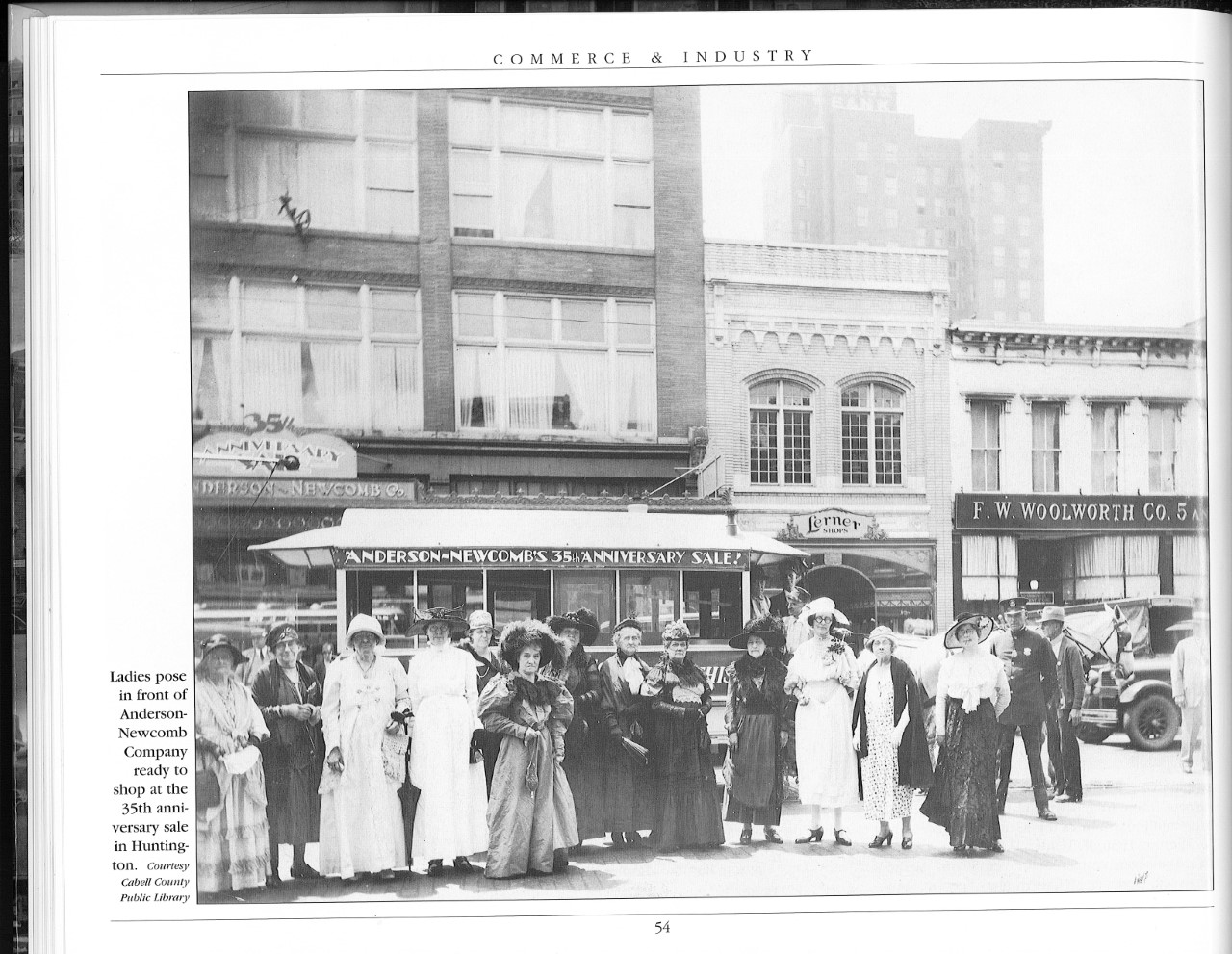 Patrons of Huntington celebrating the 35th anniversary of Anderson Newcomb. A bus stop and a Starbucks are located where they are standing today.