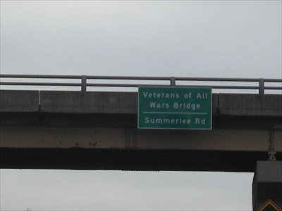 Veterans of All Wars Bridge highway sign that overlooks the 38th Parallel.