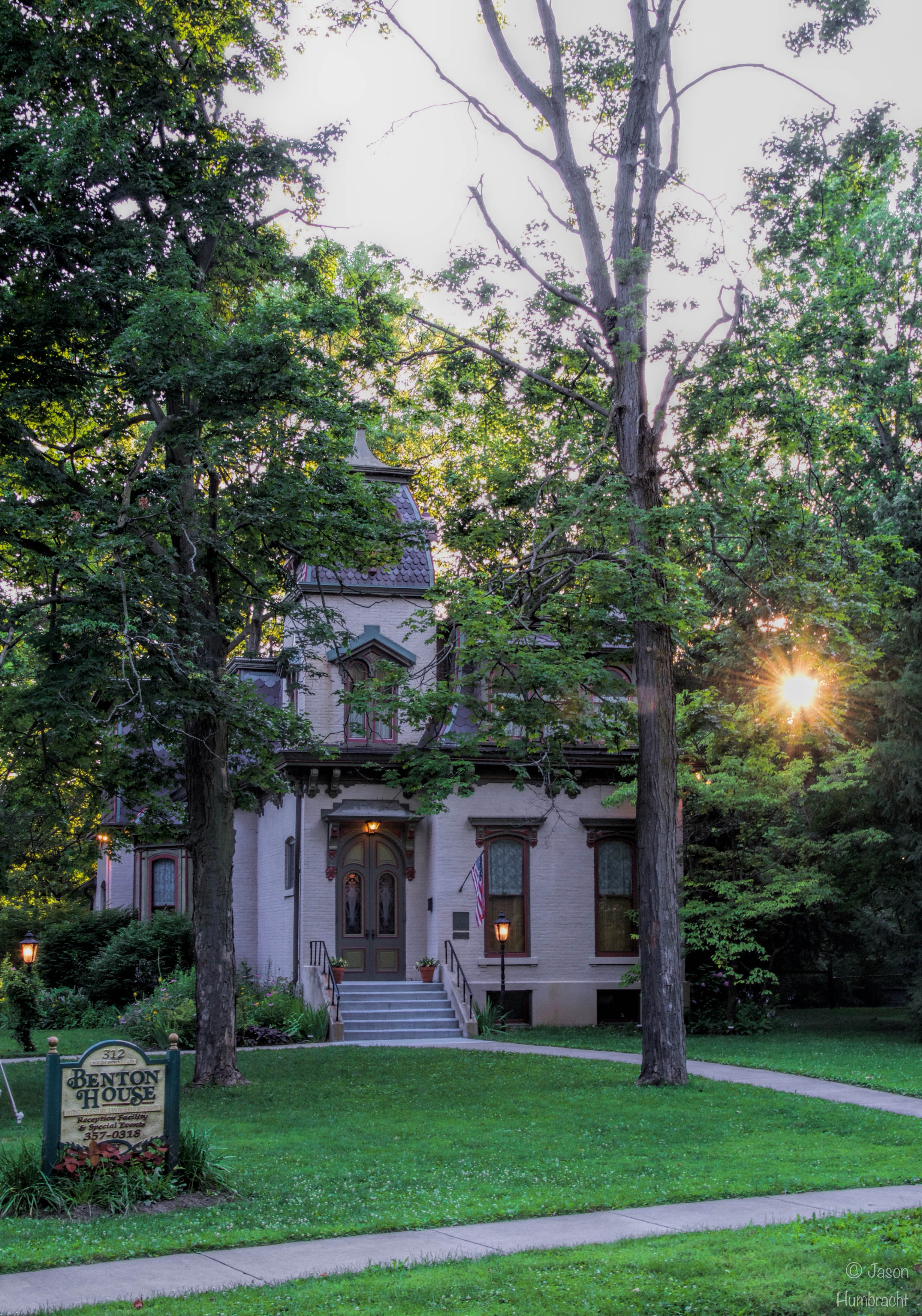 The sun sets behind the 1873 Benton House.
