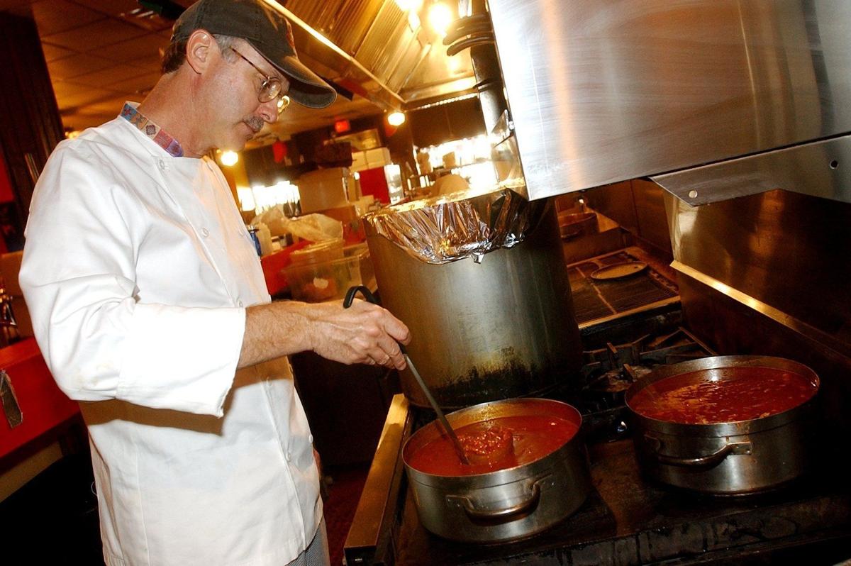 Smith stirs his famous chili, 2003