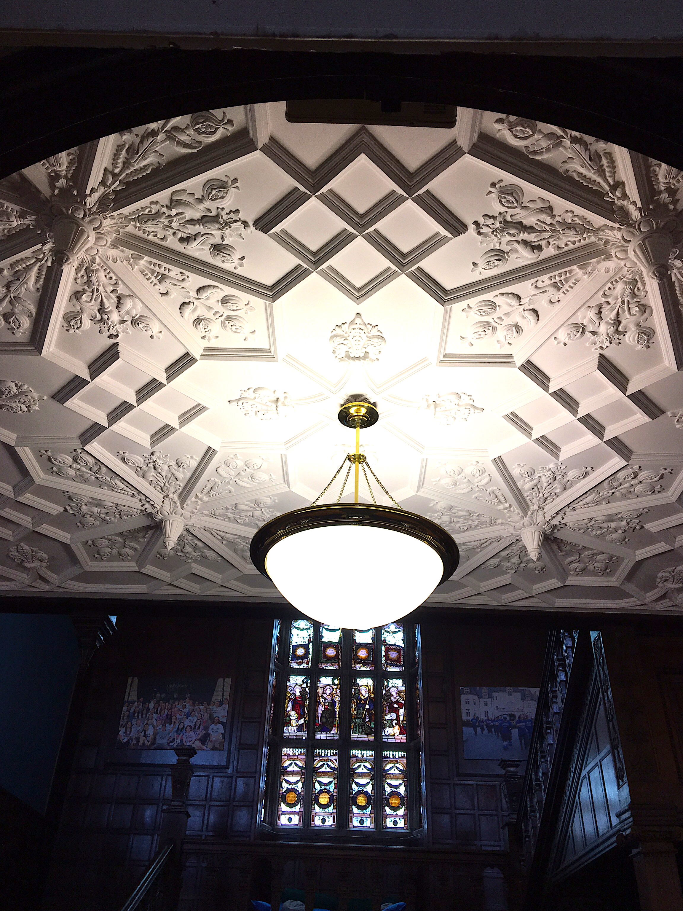 Gothic Revival Style ceiling by Dudley Newton with stained glass windows by Charles Kempe in the background