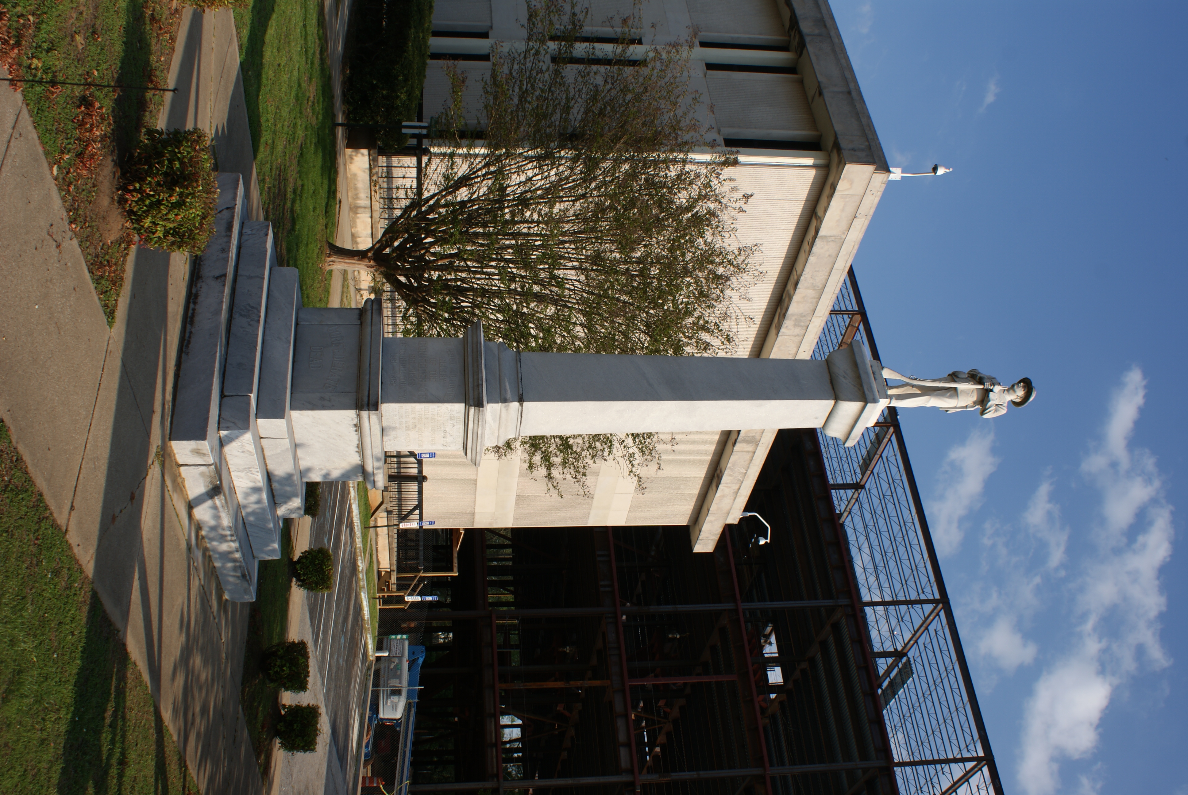 Carroll County Confederate Monument on 9 April 2011 with the construction of the new county courthouse in the background.