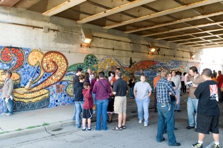 Photo from murals dedication, highlighting the mosaic image of the drum producing music. Photo Credit: Al Candelario / Fydagraphy, 2009 (See Klockars article)