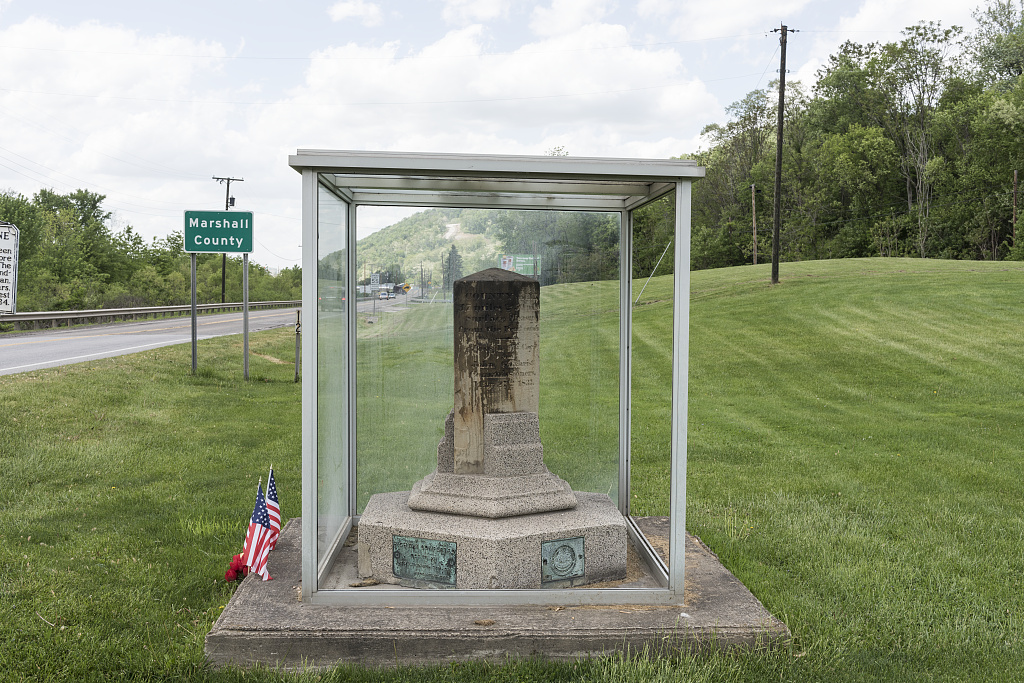 A photo of the Mason Dixon Monument, right beside the Marshall County line.