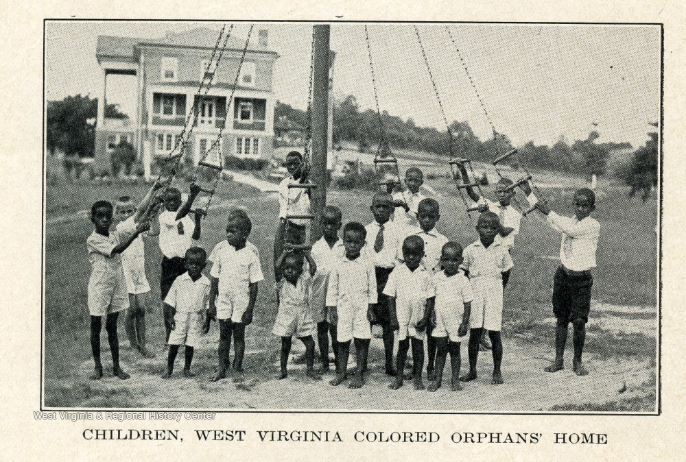 Children of the West Virginia Colored Orphan's Home  playing on swings