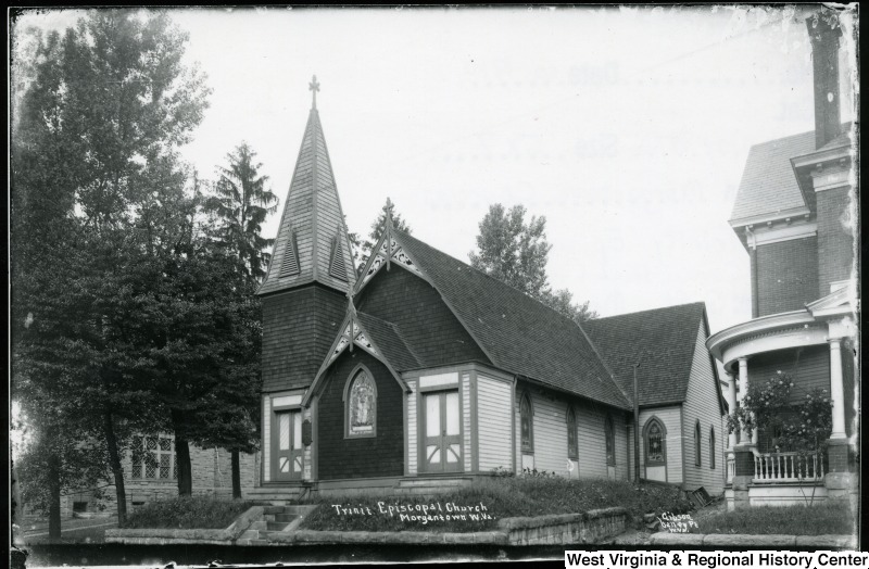 Photograph of the Trinity Episcopal Church ca. 1910. The Walters Residence is visible to the right of the church. Photo credit: West Virginia & Regional History Center, WVU Libraries