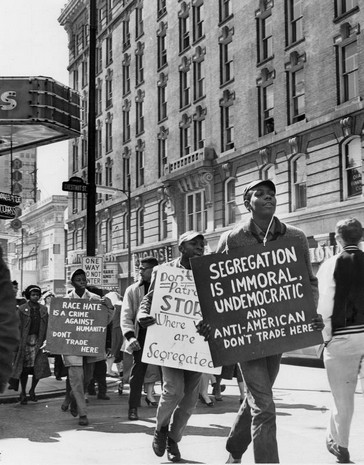 A 1961 protest against segregation near Kaufman-Straus Department store.