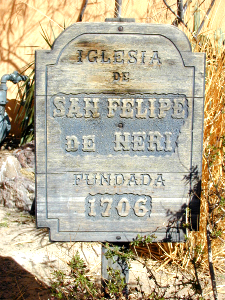 Sign near church where first church building for the city was located and when it was constructed.