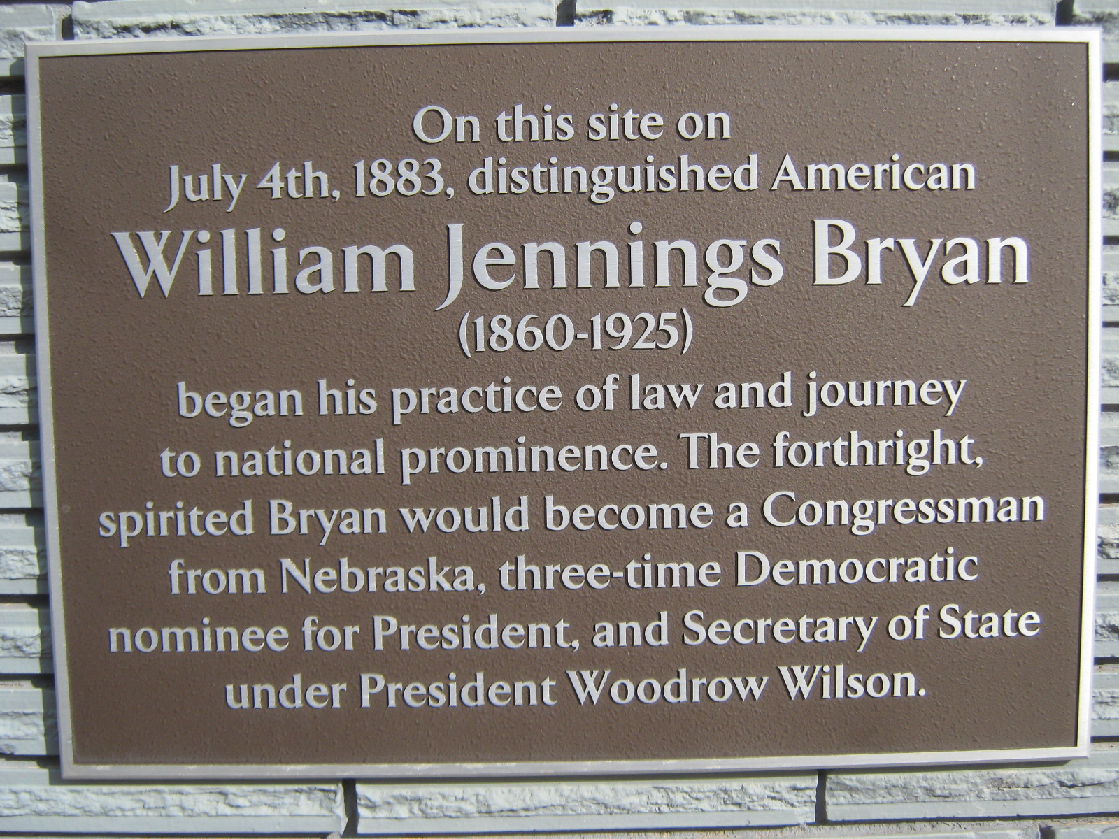 Plaque located at 232 West State St.