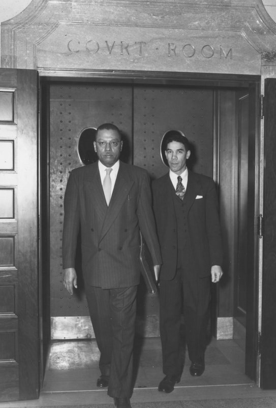 Lyman Johnson and Kentucky State University President R.B. Atwood leave federal court after the court ruled in favor of Johnson's admission to the University of Kentucky, March 1949