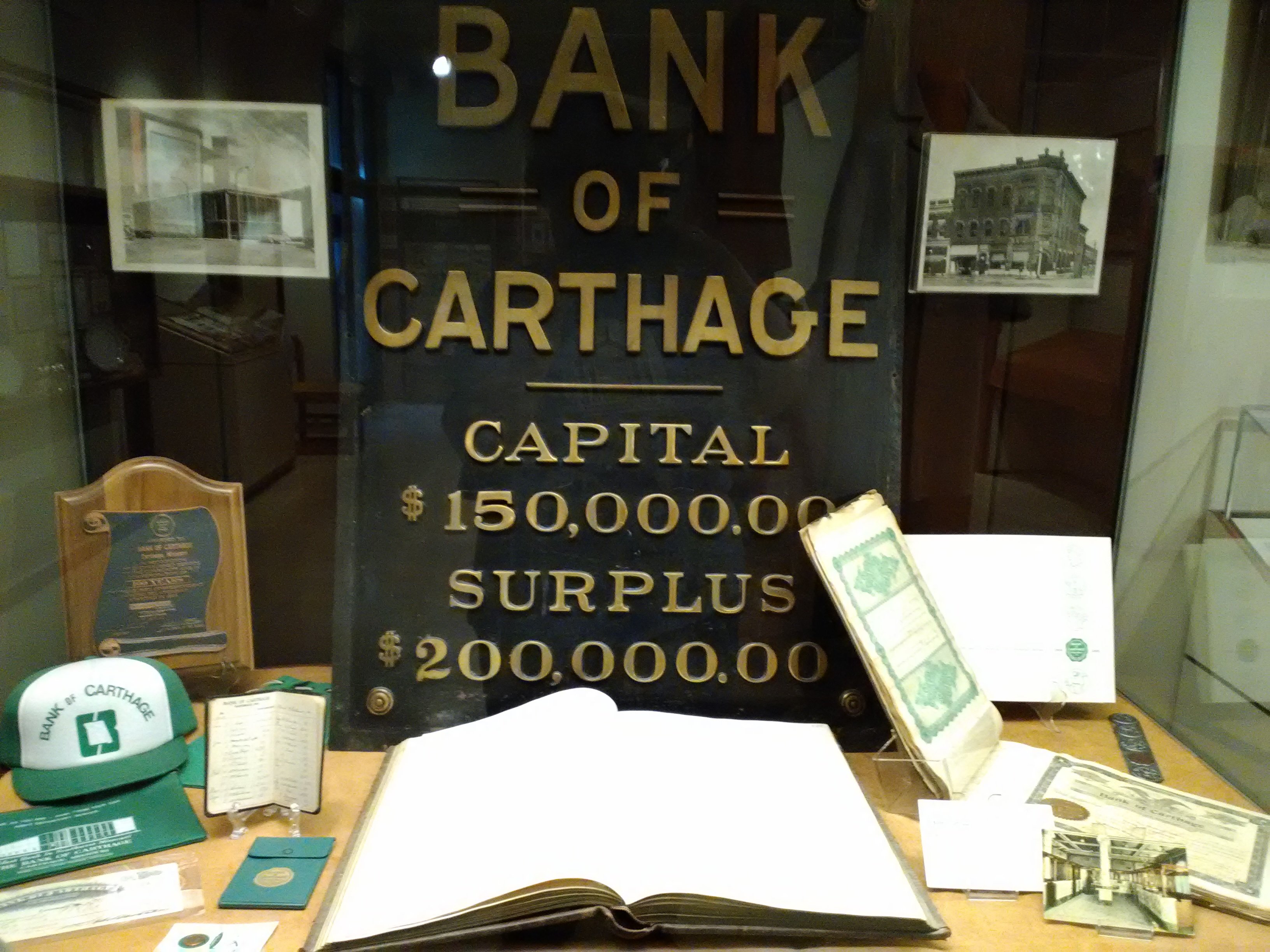 Bank of Carthage items including one of two building signs owned by the Powers Museum on display for the 175th Anniversary of Carthage Exhibit in 2017.