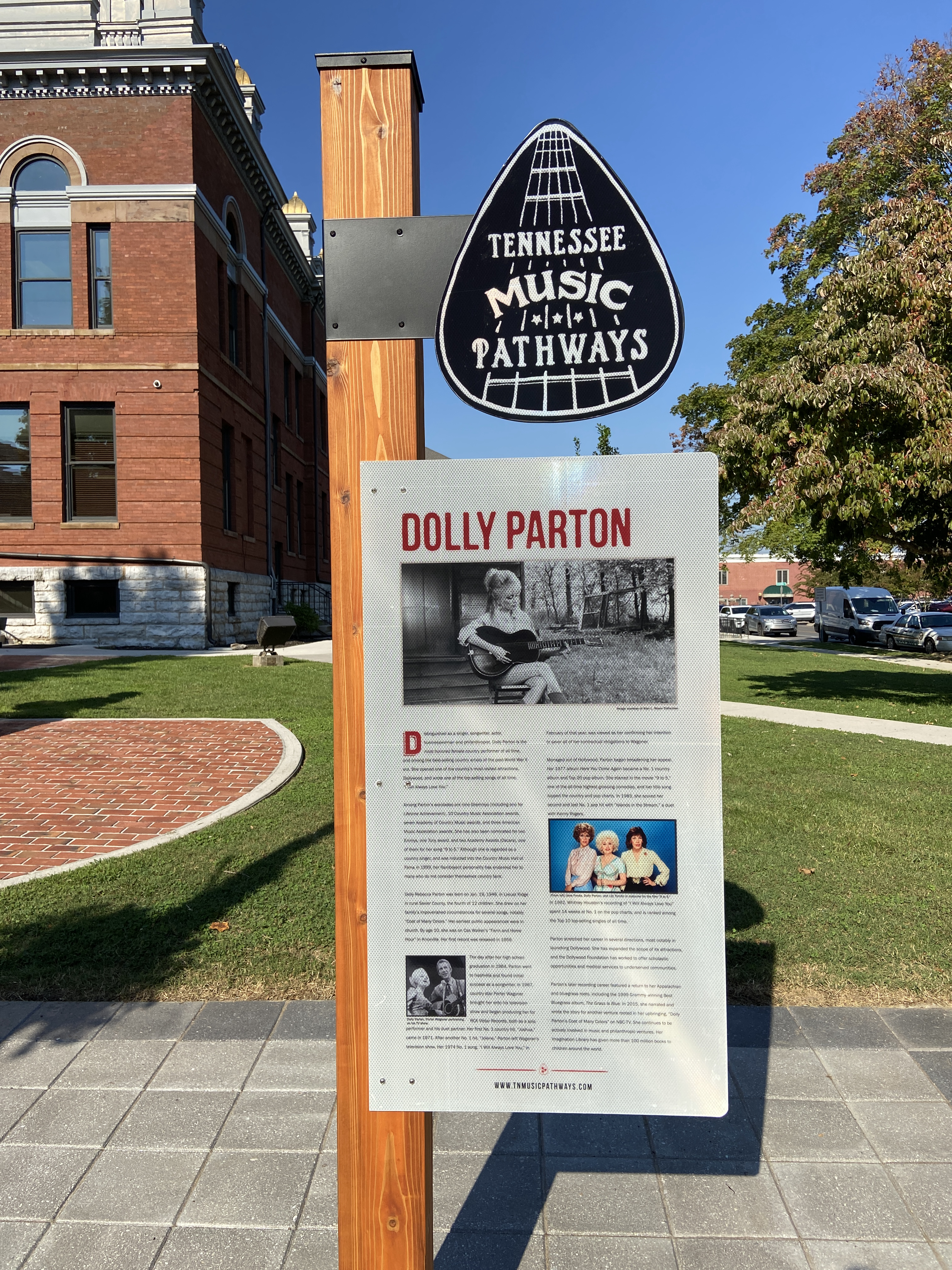 A Tennessee Music Pathways Marker Dedicated in Dolly Parton's Honor is Located Near the Statue