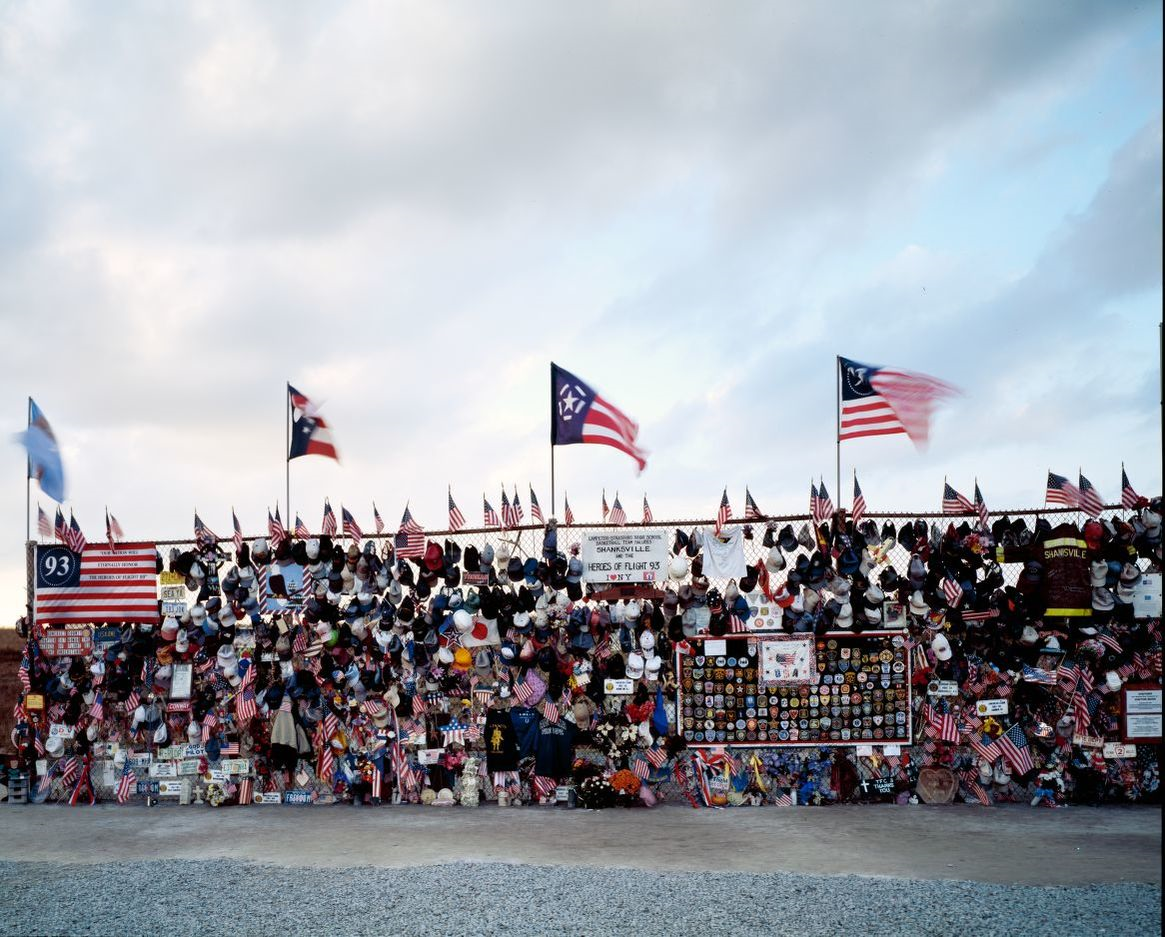 Memorial Gate existed as a temporary memorial in the months following the attack. Mourners attached cards, stuffed animals, religious items, flags, and notes to the forty-foot fence. The fence was removed and every item left was collected and some are now displayed in the Visitors Center at the permanent memorial.