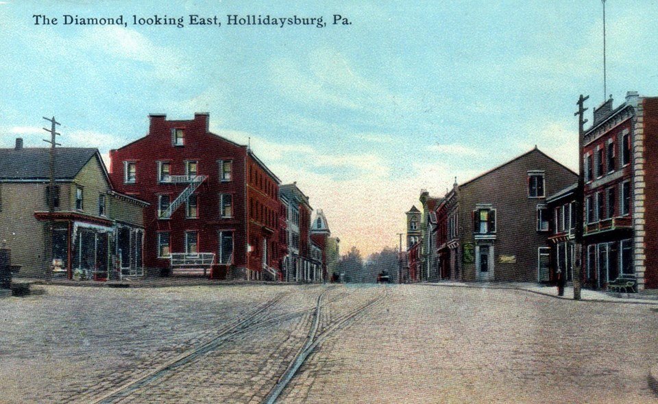 The Diamond facing East showing the American House and The Capitol Hotel circa 1910