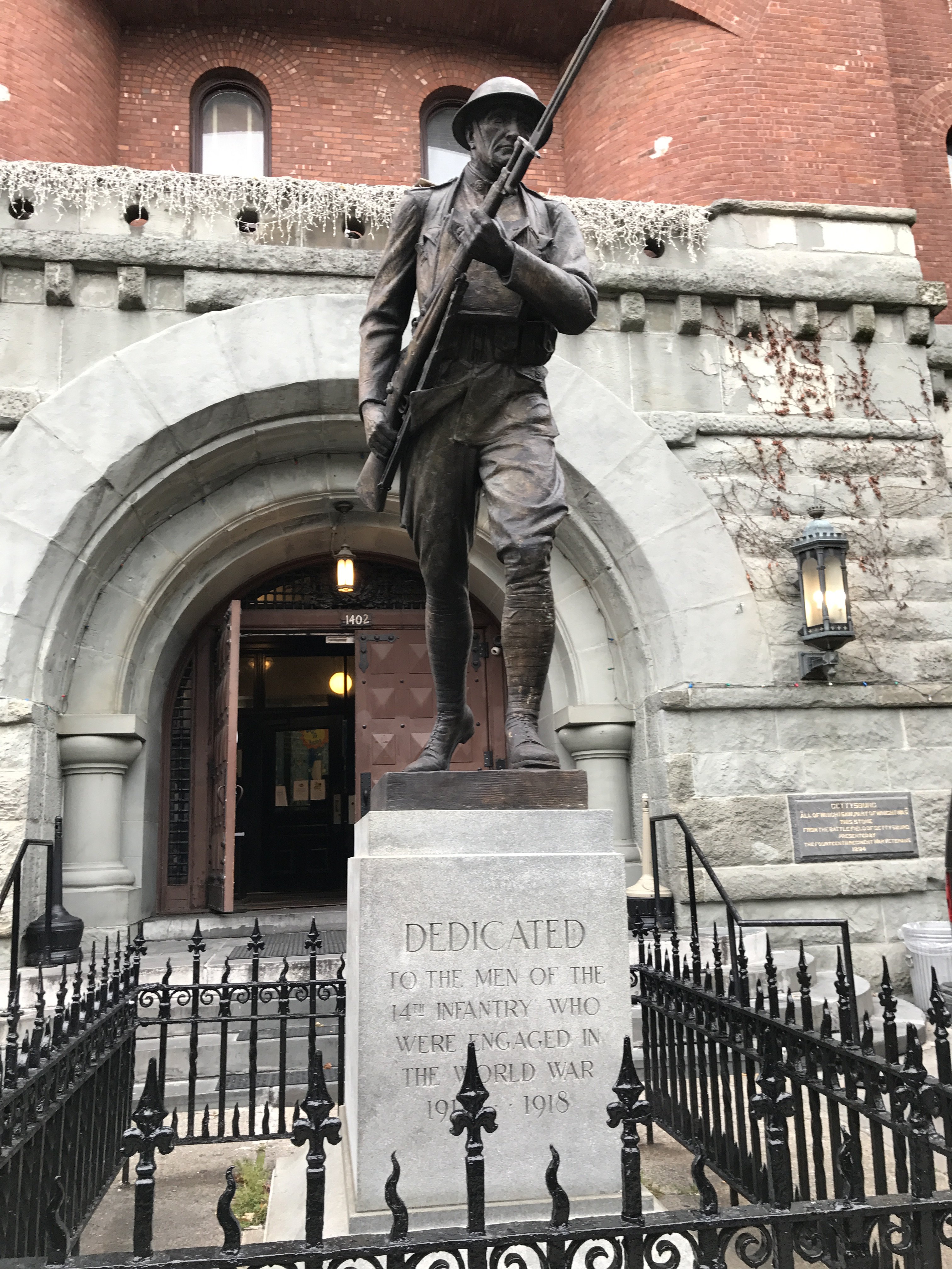 Front of Statue, outside of Park Slope Armory, YMCA. Bronze depiction a World War I Infantry soldier or Doughboy- on 8th Avenue side of building, intersection between 8th Avenue and 15th StreetPhotographer: