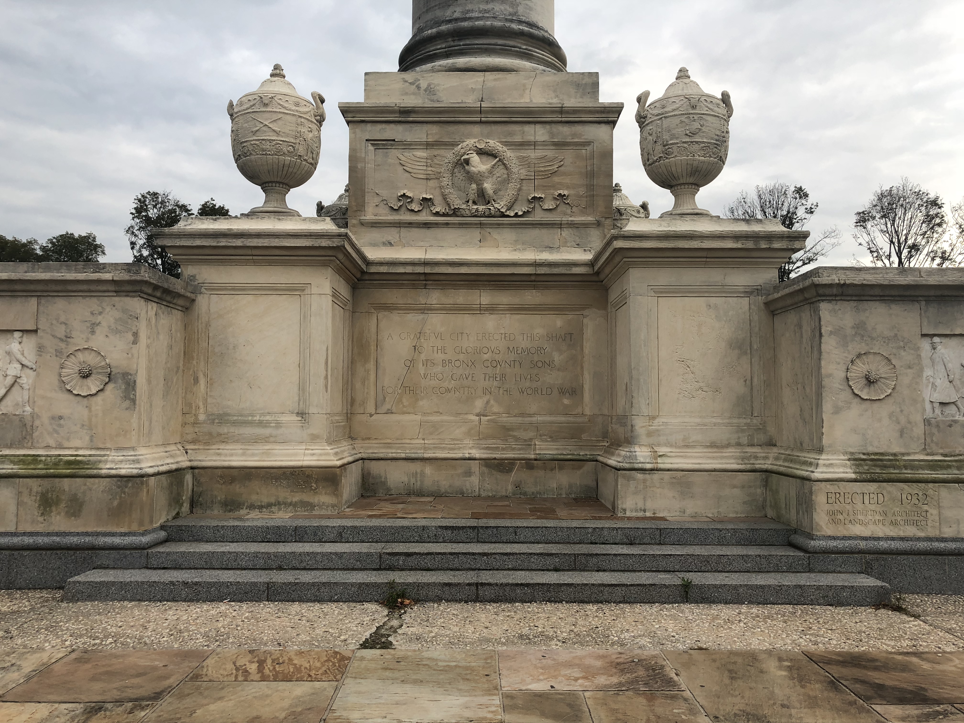 The base of the monument reads: "A GRATEFUL CITY ERECTED THIS SHAFT TO THE GLORIOUS MEMORY OF ITS BRONX COUNTY SONS WHO GAVE THEIR LIVES FOR THEIR COUNTRY IN THE WORLD WAR"