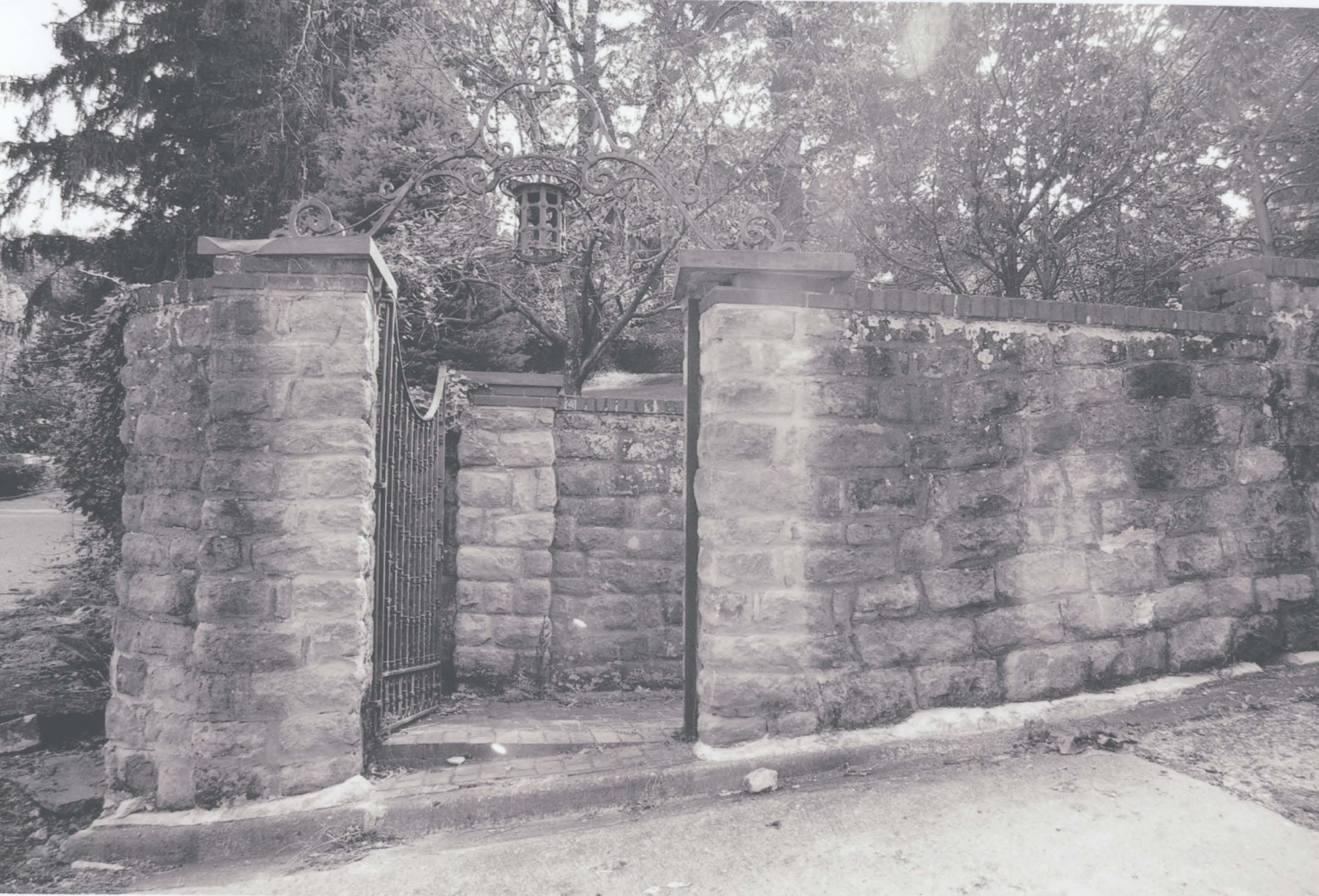 Stone gate entrance at the northeast corner of the property, pictured in 2006