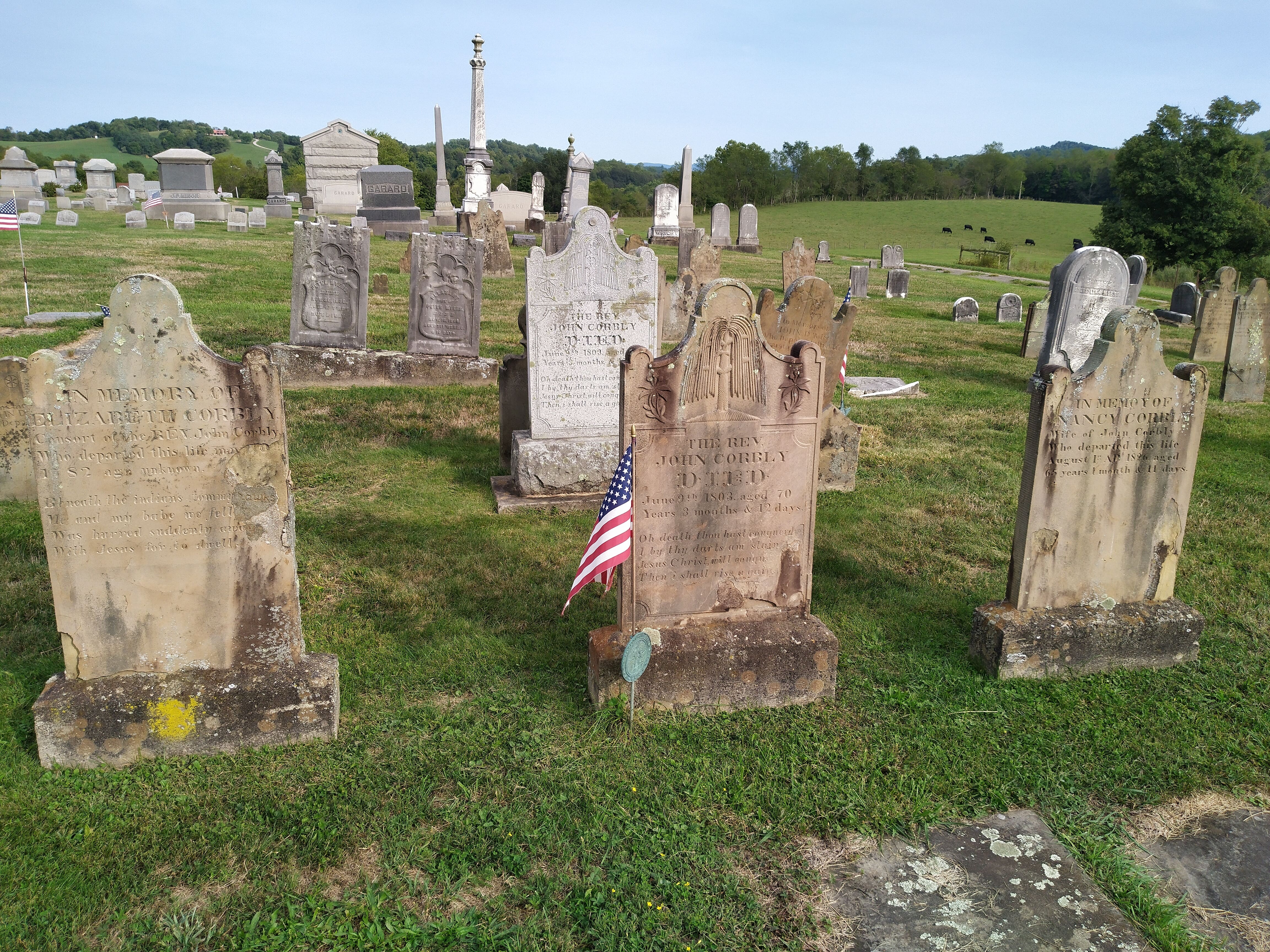 The grave of John Corbley (center) with his second and third wives beside him to the left and right