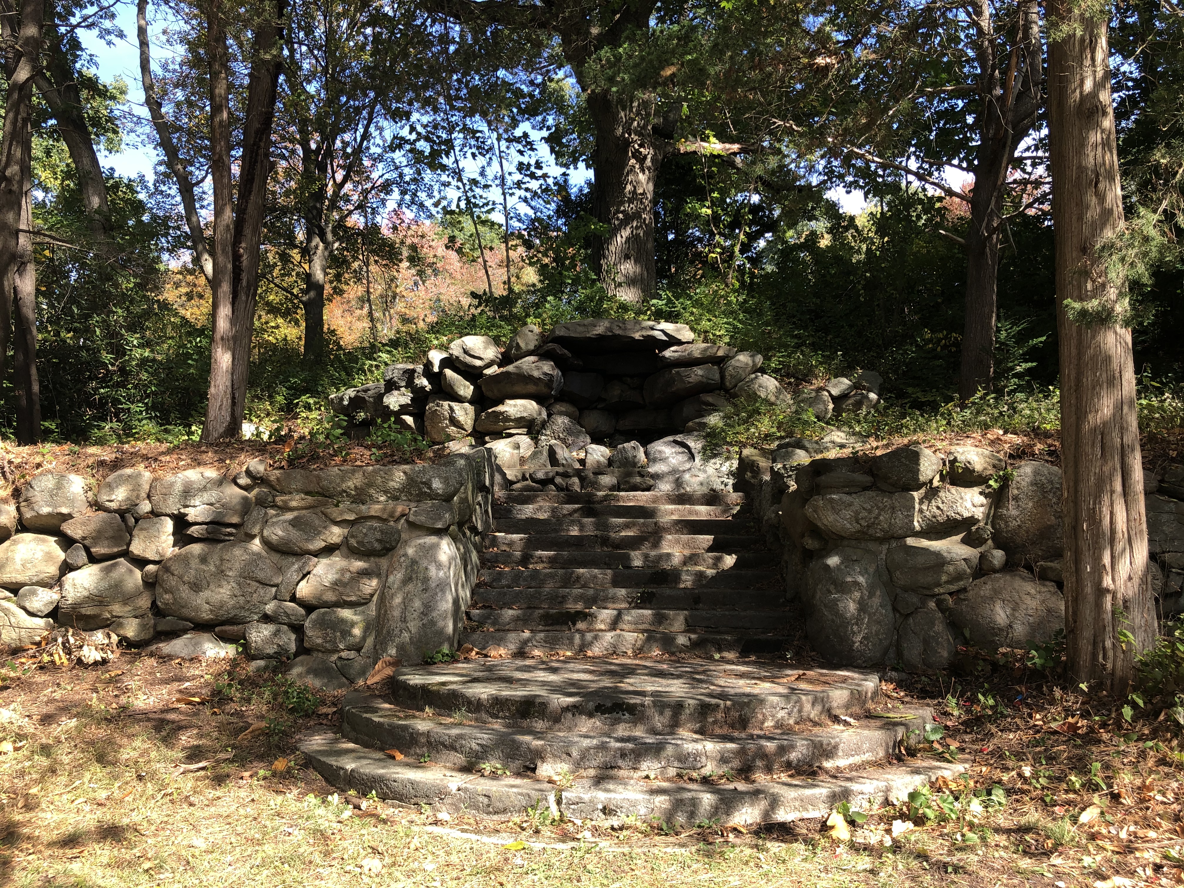 Steps leading up to a stone fireplace near Greenwood Avenue.