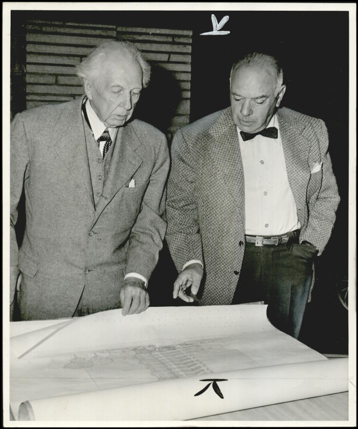 Harold Price and Frank Lloyd Wright reviewing design plans.
