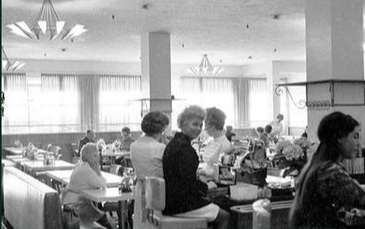 A photo of the inside of Bailey's Cafeteria, featuring all white customers.