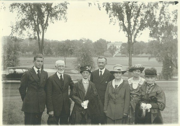Barnes, Lincoln Wade (photographer). Kenyon L. Butterfield and family, 1922.
Kenyon Butterfield is shown posing for a portrait with his family, which consists of a son, three older women and an older man, and his wife.