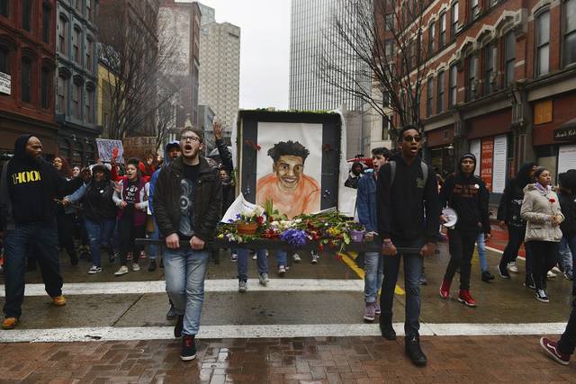 The Antwon Rose II memorial drawing is carried by protesters down Liberty Avenue in Pittsburgh days after Michael Rosfeld was acquitted of all charges