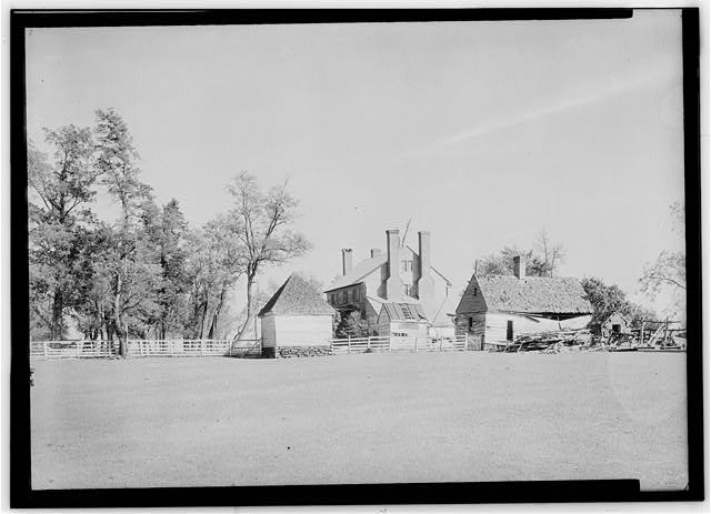 Photograph of smokehouse, Effingham main house, and slave quarters ca. 1930s
