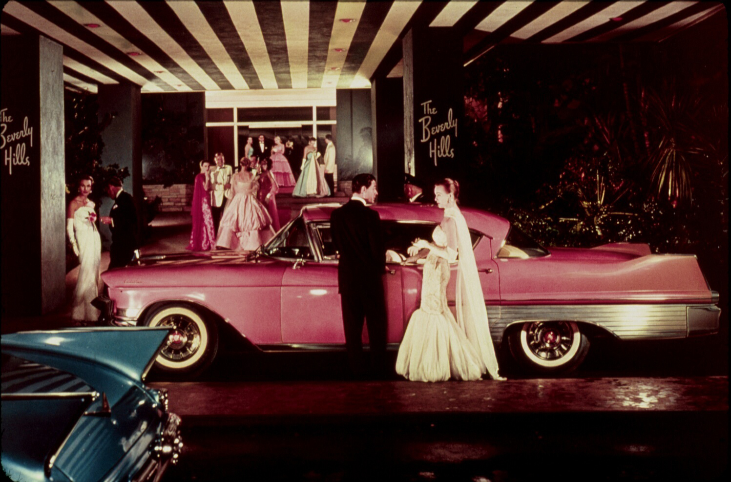 A glamorous 1957 Cadillac advertisement staged at the Beverly Hills Hotel